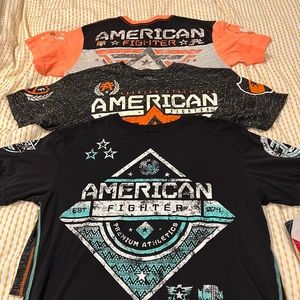 American fighter T-shirts all size extra large orange, black and blue.